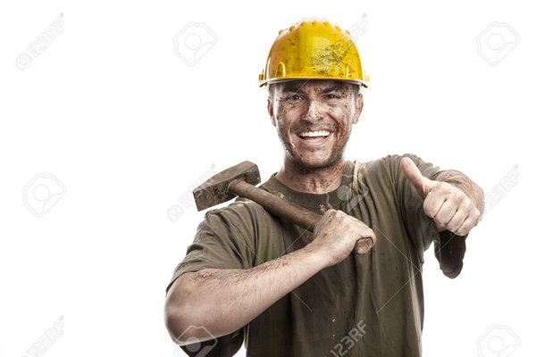 29565728 young dirty smiling worker man with hard hat helmet holding a stock photo